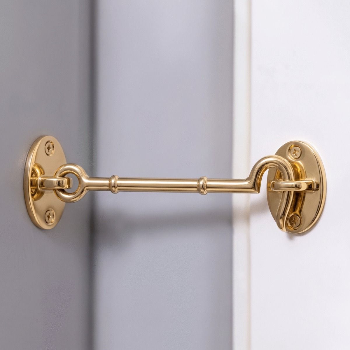 The 8 Inch Brass Cabin Hook Loose Ring Type Holding open a White Door in a Modern Home - Digital Illustration