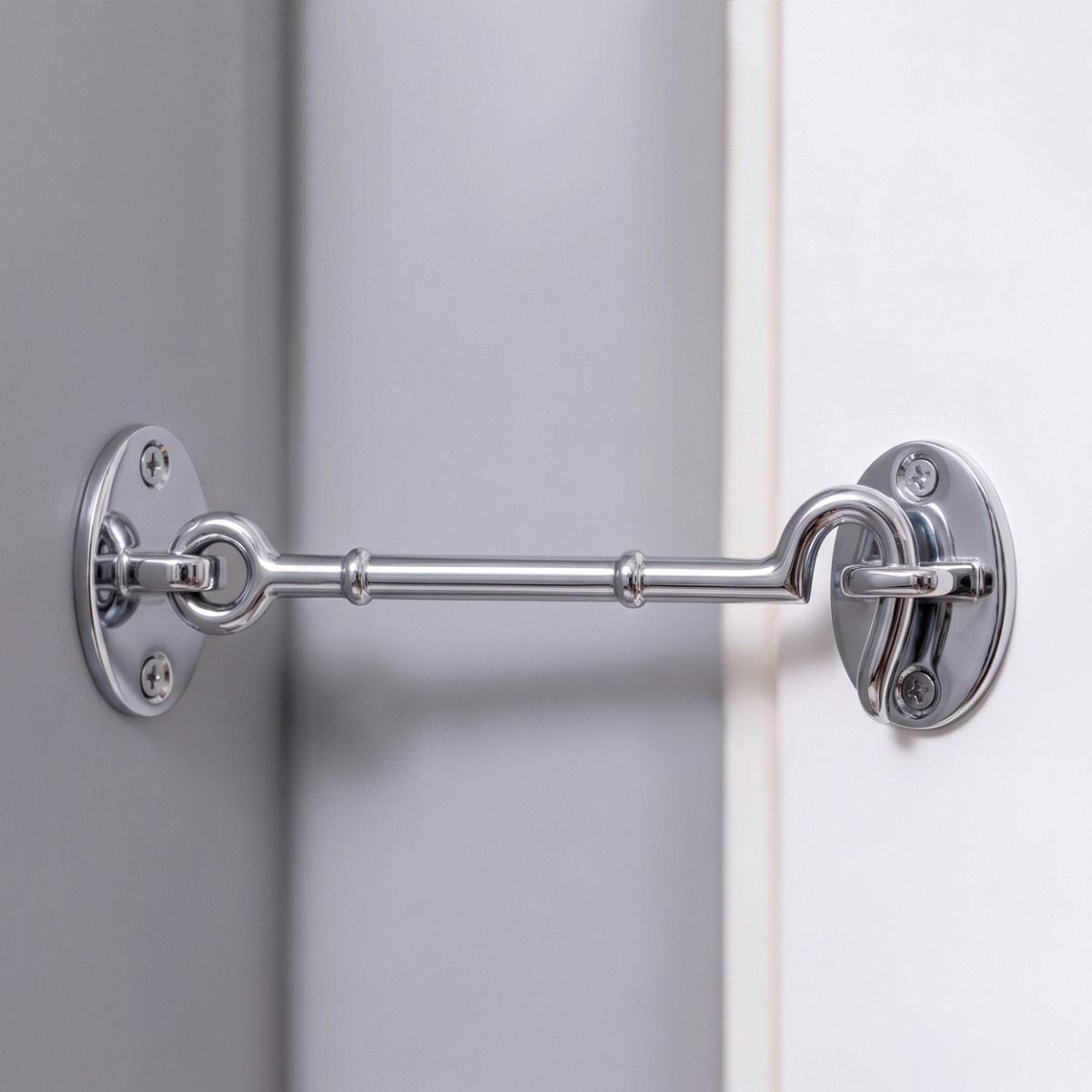 The 8 Inch Brigth Chrome Cabin Hook Loose Ring Type Holding open a White Door in a Modern Home - Digital Illustration 