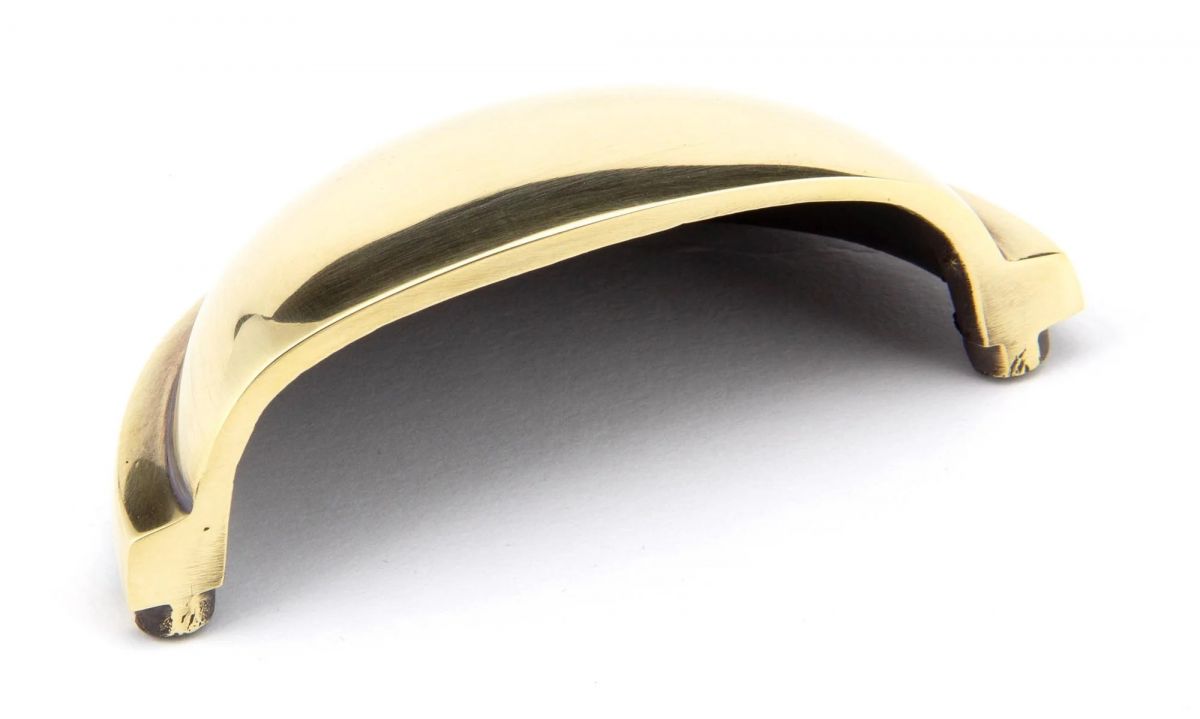 The Aged Brass Finish Cup Pull Handle on a White Background Shown from Underneath