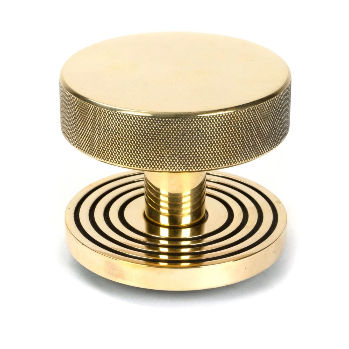 The Aged Brass Knurled Centre Door Knob on Beehive Rose Shown Upright on a White Background 