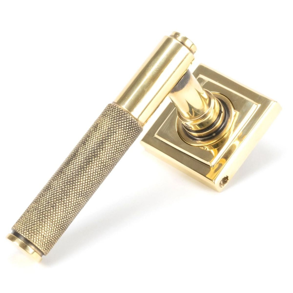 The Aged Brass Knurled Lever on Square Rose Set on a White Background 