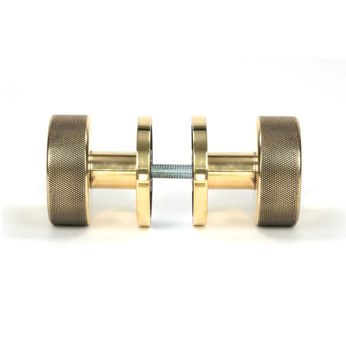 The Aged Brass Knurled Mortice/Rim Knob Set on a Plain Rose Shown Screwed Together from the Side 
