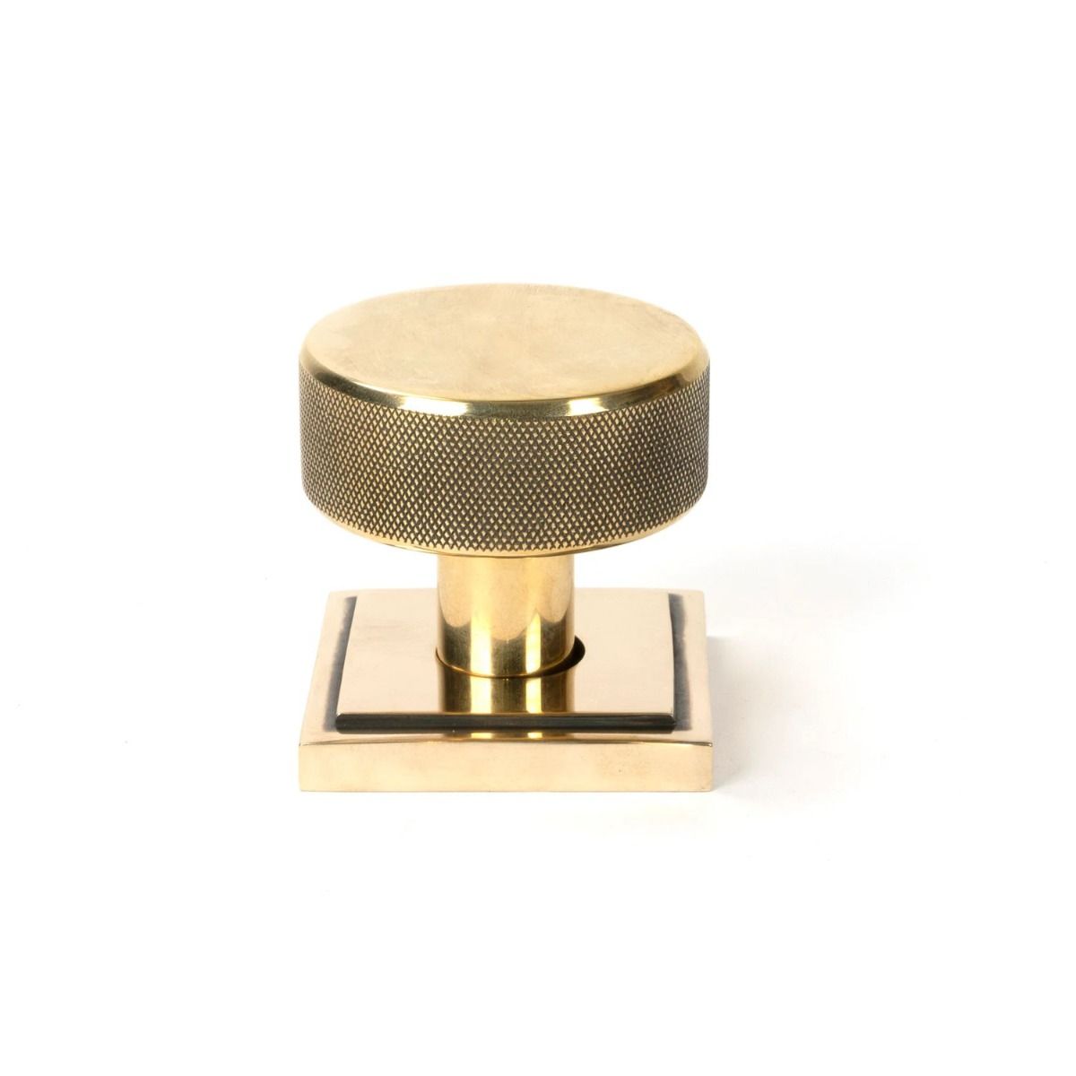 The Aged Brass Knurled Mortice/Rim Knob Set on a Square Rose Shown Upright on a White Background 