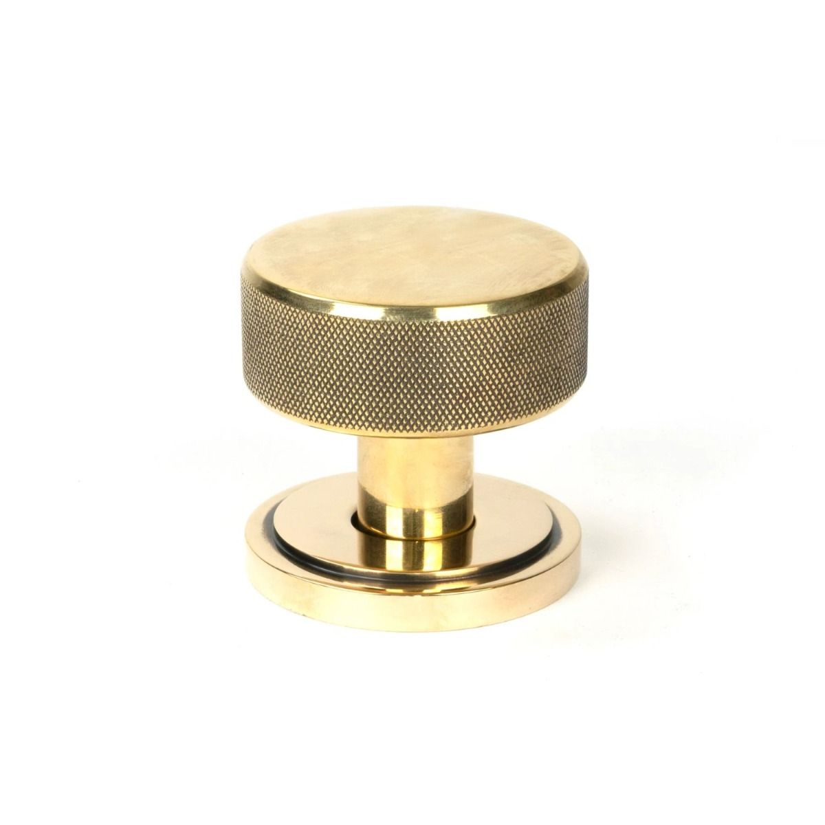 The Aged Brass Knurled Mortice/Rim Knob Set on an Art Deco Rose Shown Upright 
