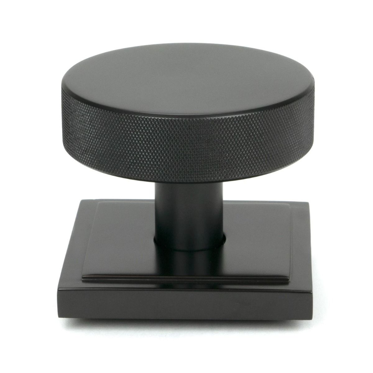 The Aged Bronze Knurled Centre Door Knob on a Square Rose Shown Upright on a White Background 
