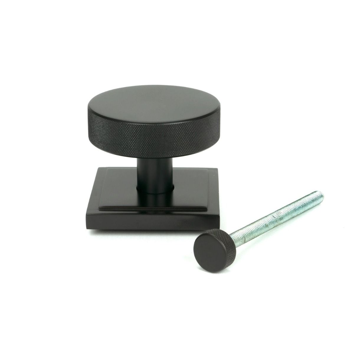The Aged Bronze Knurled Centre Door Knob on a Square Rose with Bolt Fitting on a White Background 