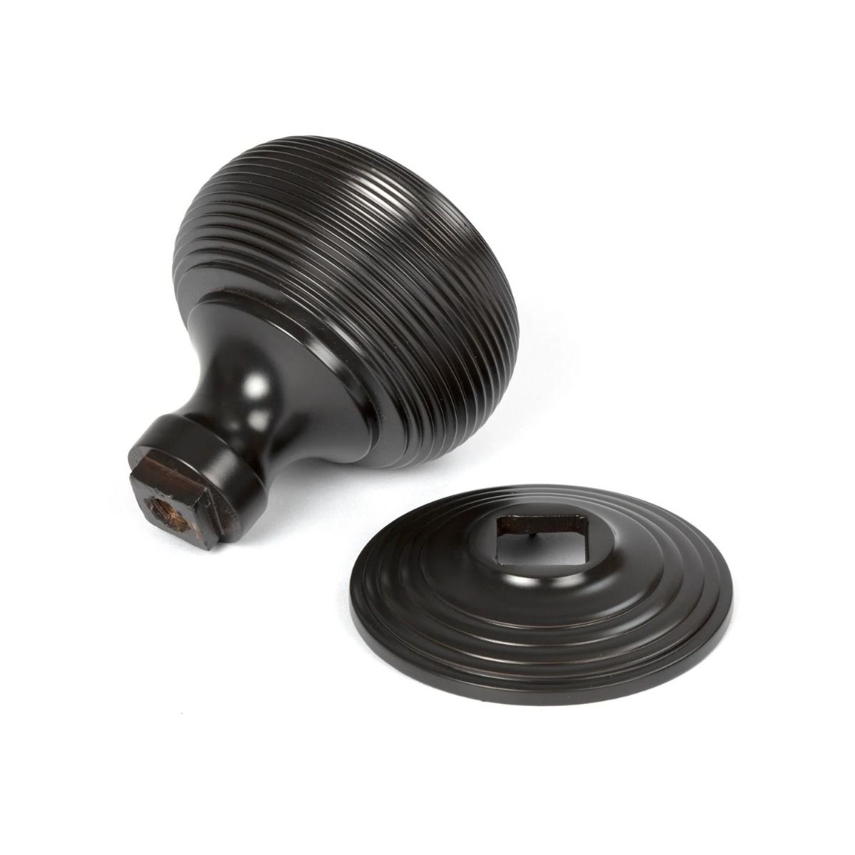The Aged Bronze Traditional Beehive Centre Door Knob shown from Behind on a White Background 