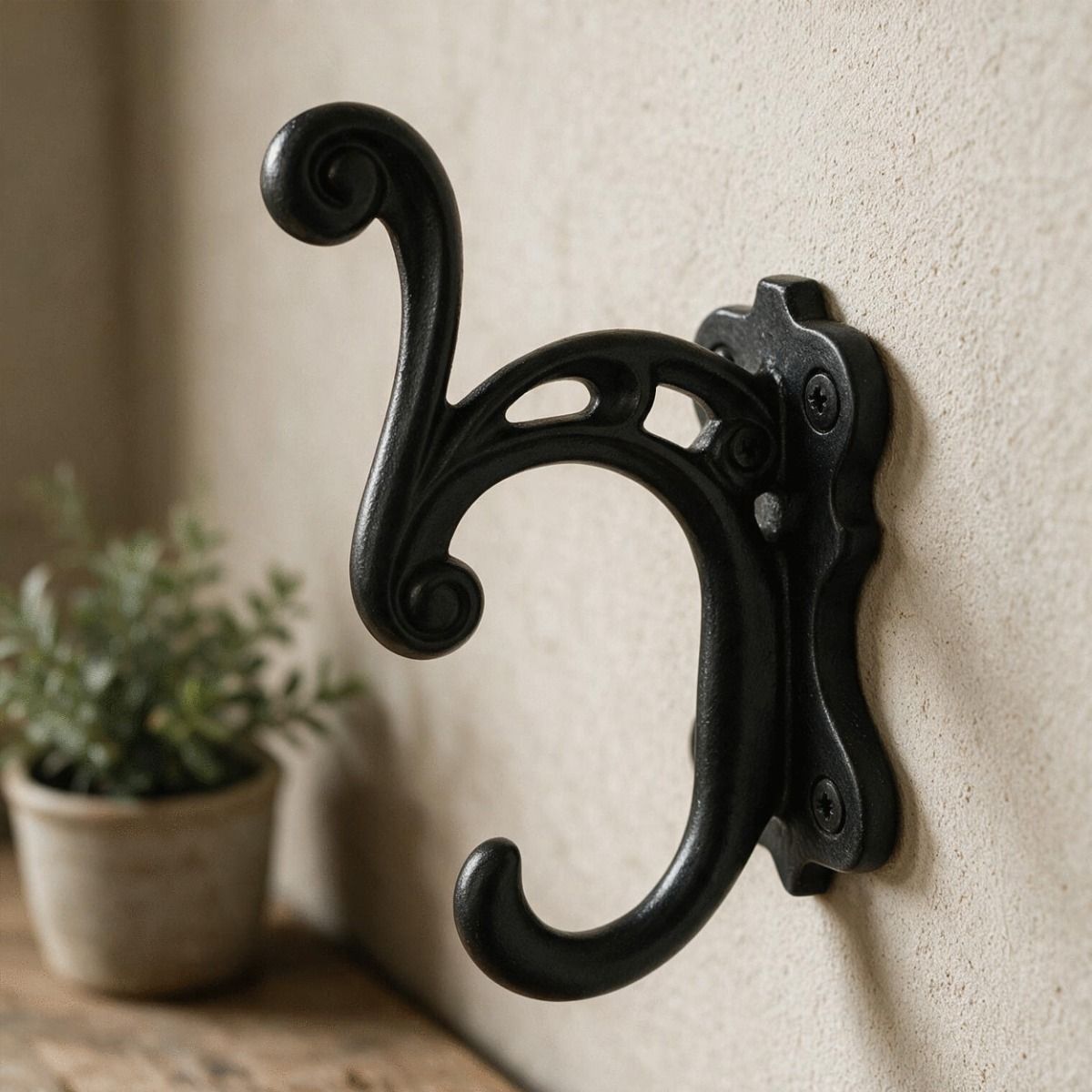 The Alexis Door Hook Fitted onto a Sand Coloured Wall Shown Close up - Digital Illustration 
