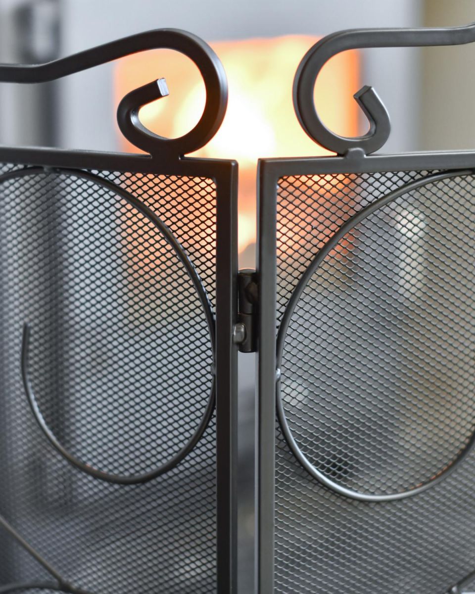 Close Up Of "The Antiquitas" Three Fold Fire Guard Scroll Work