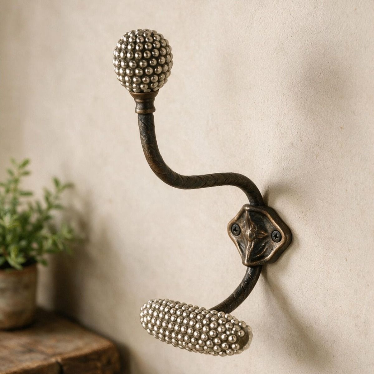 The "Araminta" Polished Brass Beaded Coat and Hat Hook Fitted onto a Sunlit Wal in a Modern Home Interior Setting - Digital Illustration