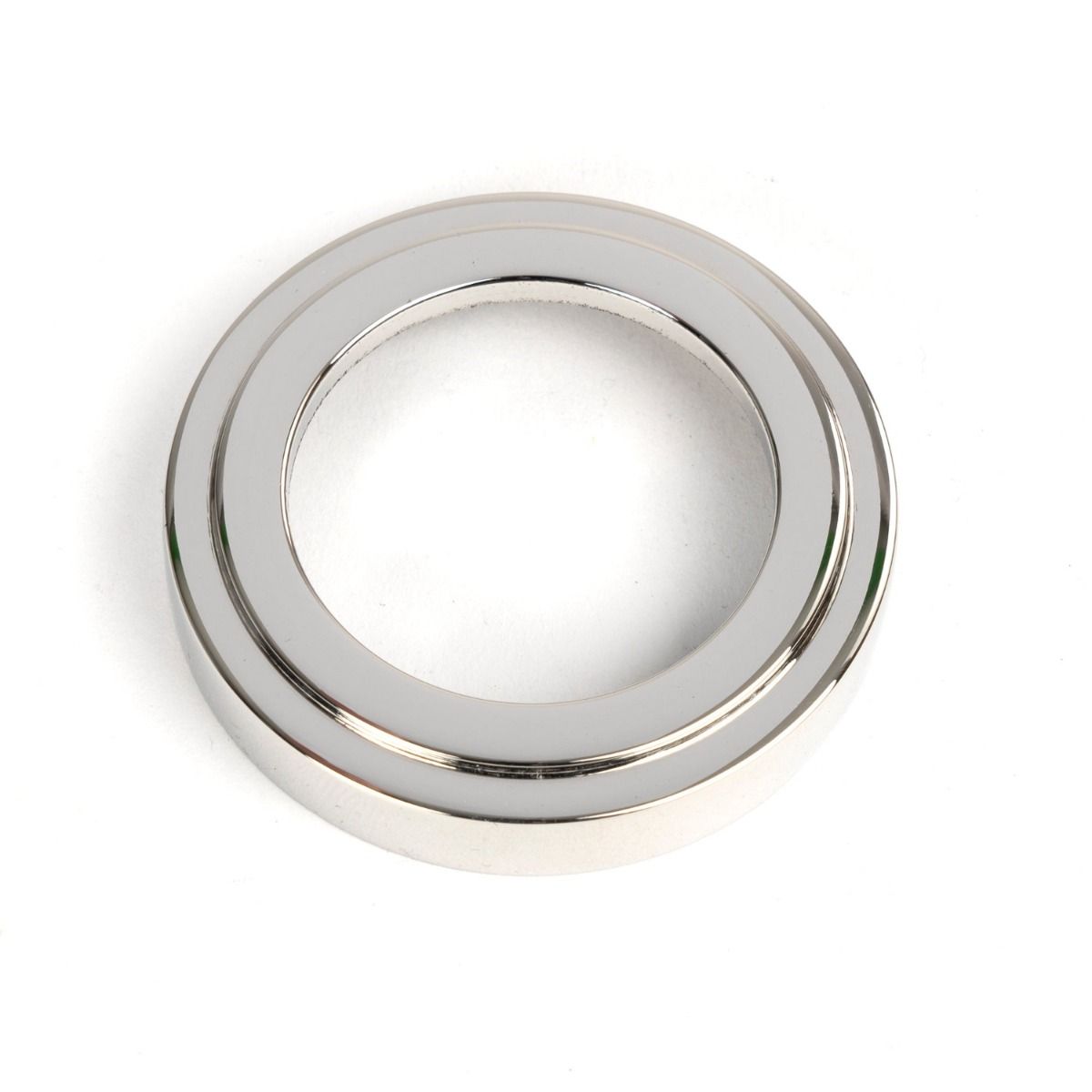 The Art Deco Concealed Euro Keyhole Escutcheon in Polished Stainless Steel Showing Just the Backplate on a White Background