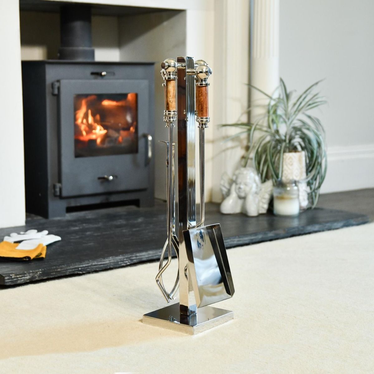 The "Ashcombe" Stainless Steel Companion Set with Hardwood Handles in Front of a Modern Fireplace  - Digital Illustration 