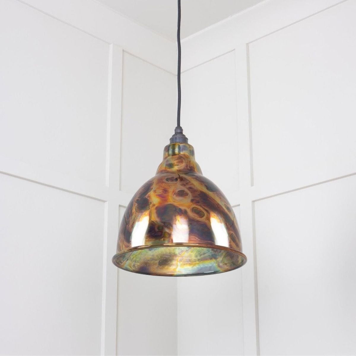 The Aura Dome Pendant Light in Burnished Brass Shown from a Low Angle