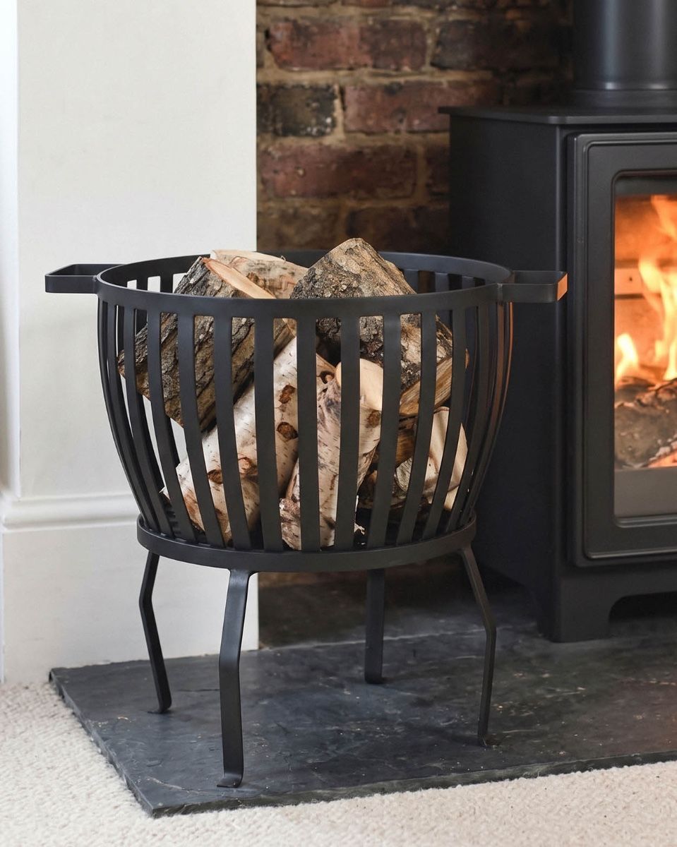 The "Barrow" Traditional Log Basket Filled with Logs Displayed to the side of a Log Burner Stove - Digital Illustration 
