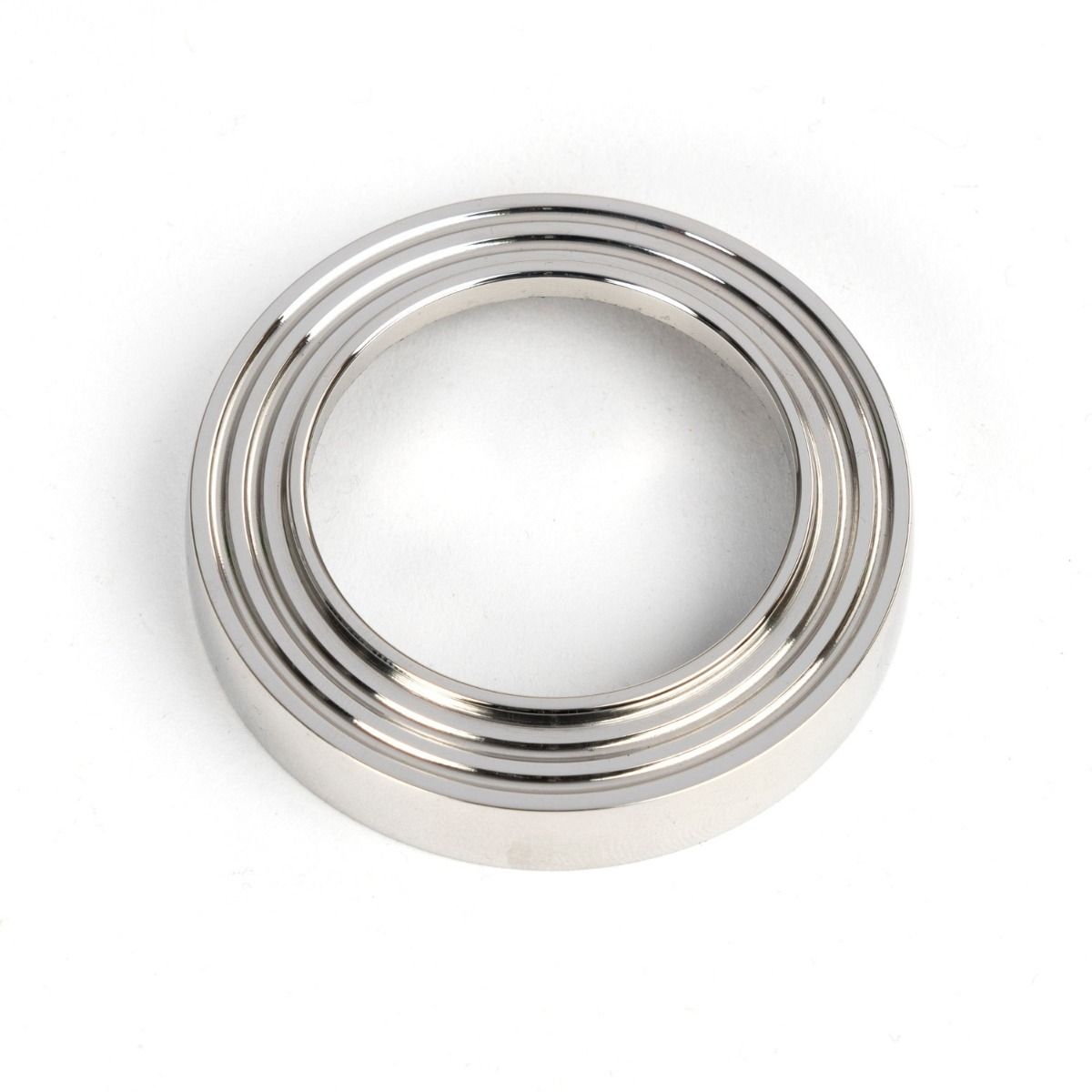 The Beehive Concealed Euro Keyhole Escutcheon in Polished Stainless Steel Showing Just the Backplate on a White Background
