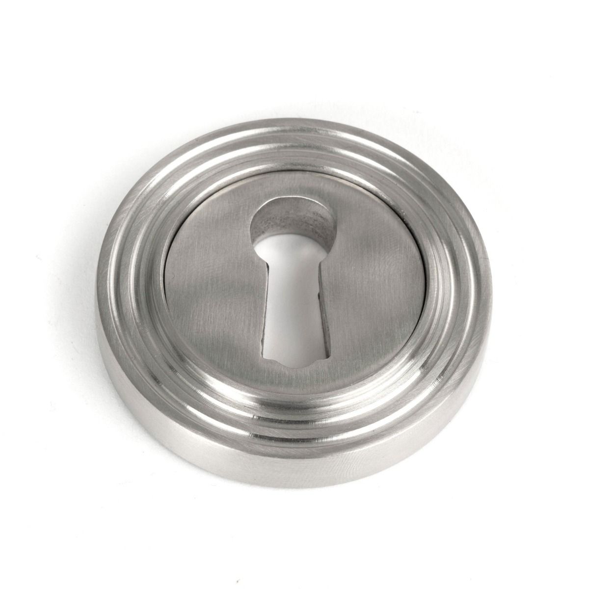 The Beehive Concealed Standard Keyhole Escutcheon in Satin Stainless Steel Shown on a White Background