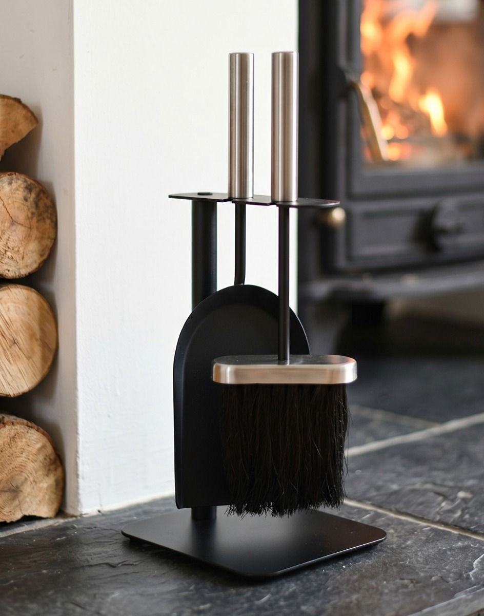 The “Birchdale Avenue” Fireplace Brush and Pan Set on a Black Stone Hearth next to a Log Burner Stove - Digital Illustration