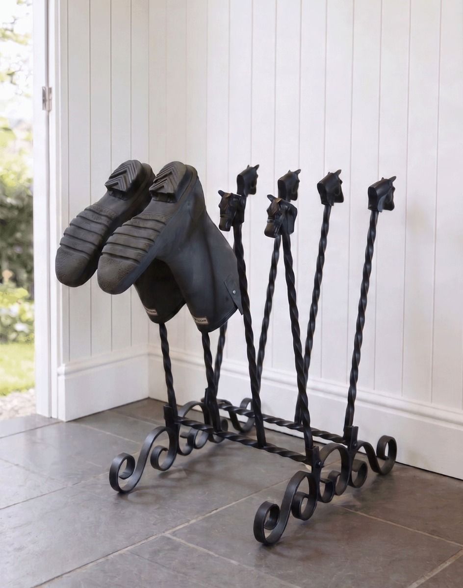 The Black Aintree Four-Pair Boot and Welly Rack Placed in a Contemporary Stone Tiled Porch - Digital Illustration 