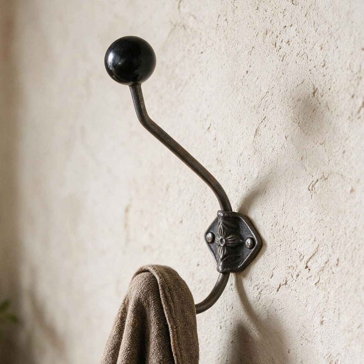 The Black Ceramic Tip Large Iron Coat Hook Shown with a Jacket Hanging From it in a Traditional Home - Digital Illustration