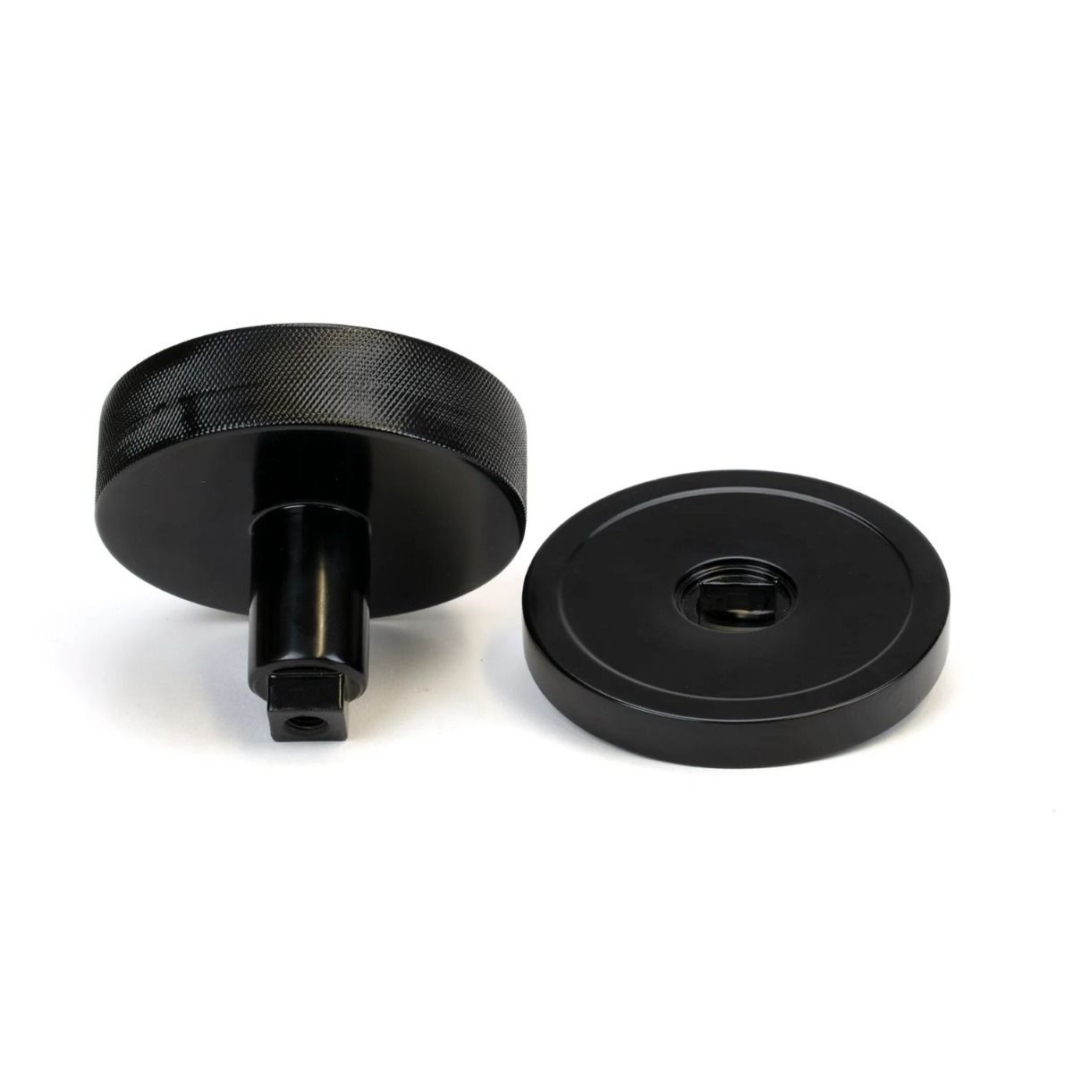 The Black Knurled Centre Door Knob on a Plain Rose Displayed in Separate Sections on a White Background 