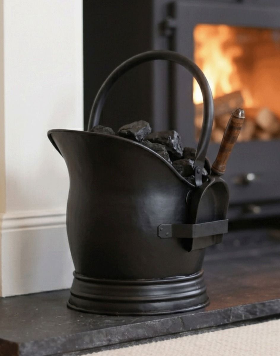 The Black Traditional Coal Bucket With Shovel in Front of a Modern Fireplace - Digital Illustration 