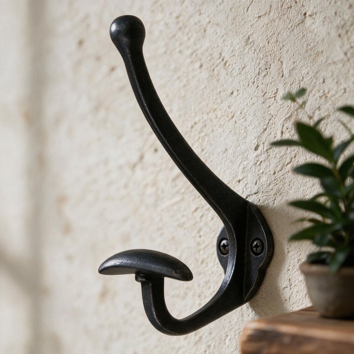 The Black Waxed Hook With Wide Coat Holder Fitted on a Wall in a Modern Interior Setting - Digital Illustration