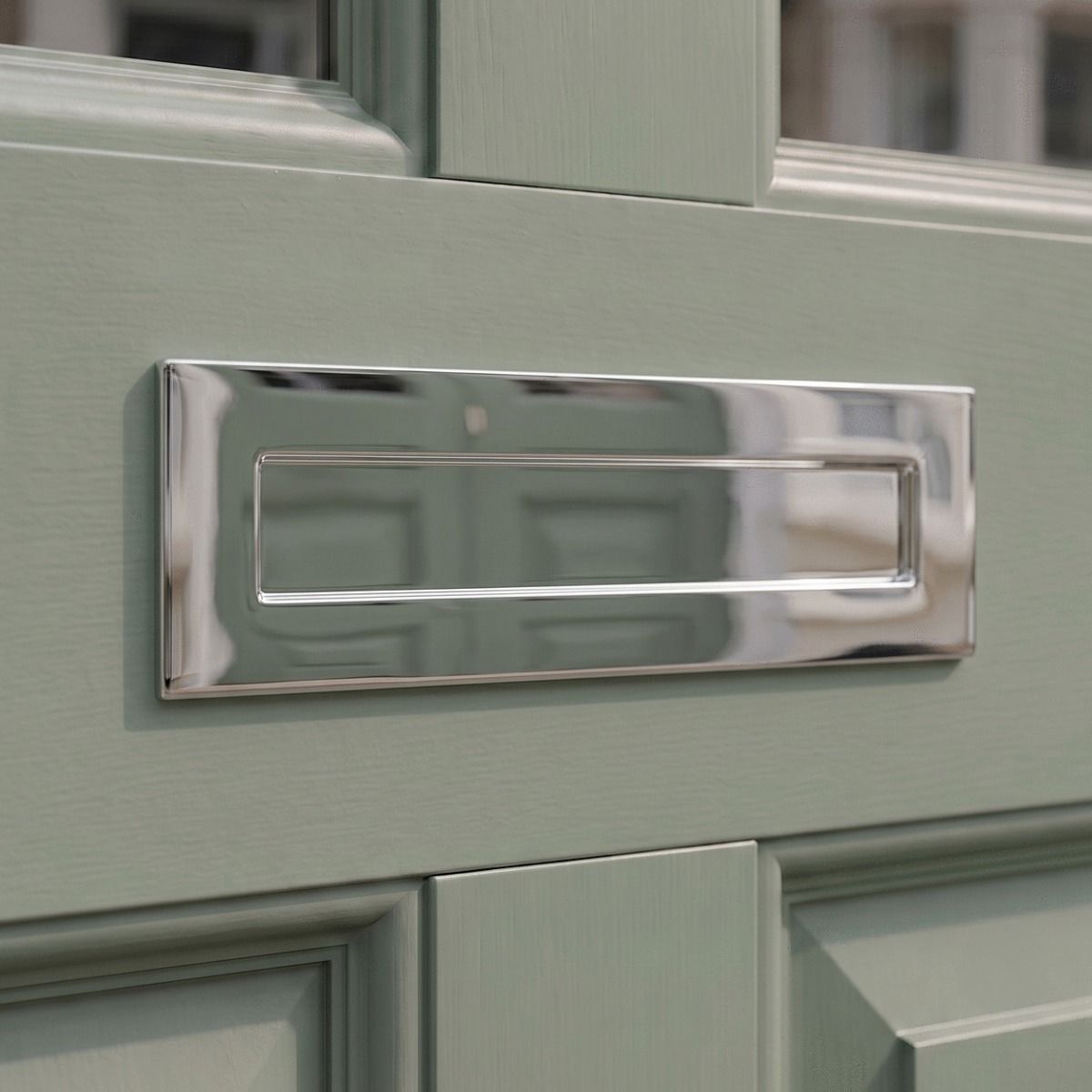 The Bright Chrome Large Traditional Letter Plate on a Light Green Wooden Door on the Front of a Home - Digital Illustration