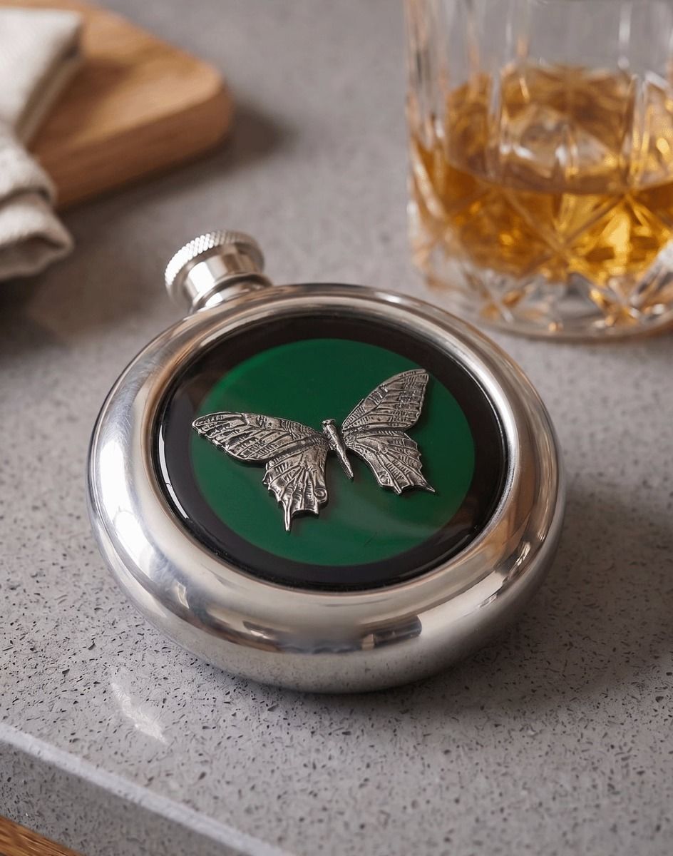 The Butterfly Whiskey Flask Placed on a Kitchen Work Surface with a Glass of Whisky - Digital Illustration