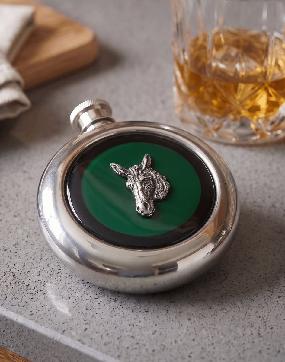 The Donkey Stainless Steel Whisky Flask with a Glass of Whiskey Next to it - Digital Illustration