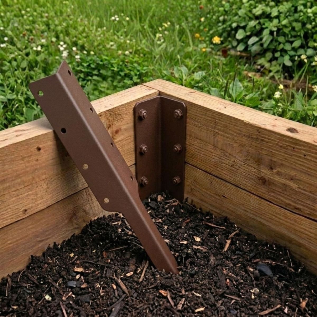 The Double Brown Railway Sleeper Corner Spike Shown next to a Raised Garden Bed - Digital Illustration