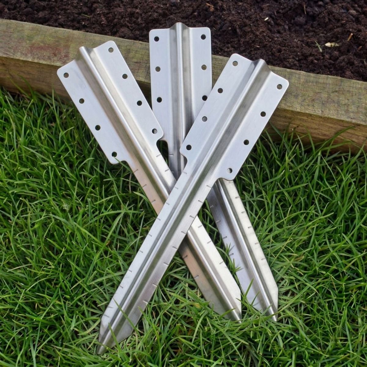 The Double Stainless Steel Railway Sleeper Straight Inline Spikes in Brown next to a Raised Flower Bed - Digital Illustration 