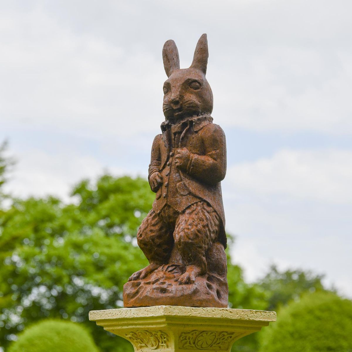The Elegant Cast Iron Rabbit Sculpture on Display on a Pillar The Elegant Cast Iron Rabbit Sculpture on Display on a Pillar