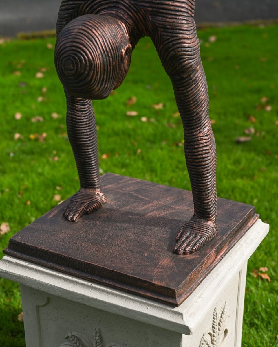 The Equilibrium Handstand Garden Sculpture in Copper Showing the Base of the Statue