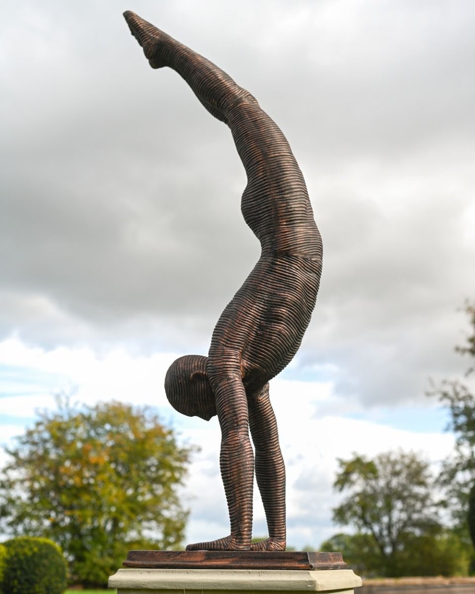 The Equilibrium Handstand Garden Sculpture in Copper Shown from the Side