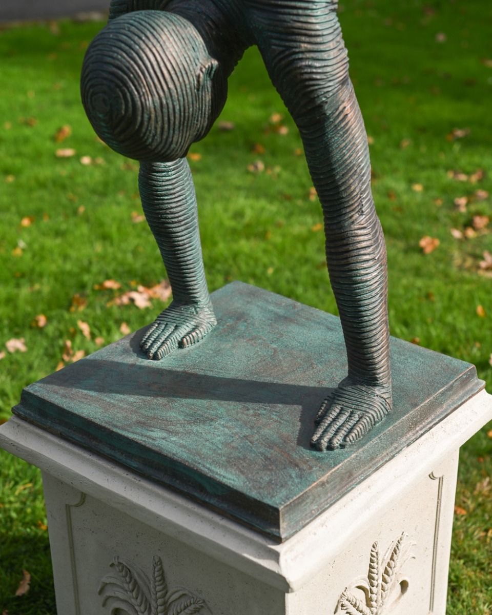 The Equilibrium Handstand Garden Sculpture in Verdigris Showing the Base of the Statue