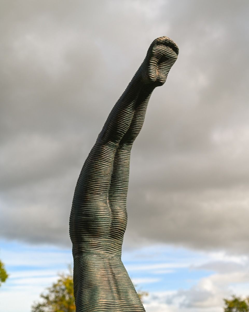 The Equilibrium Handstand Garden Sculpture in Verdigris Showing the Detailing of the legs