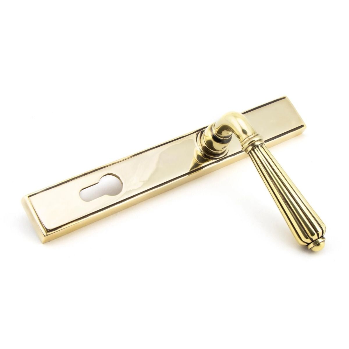 The Fluted Slimline Exterior Door Handle - Aged Brass Finish Shown from the Front at an Angle