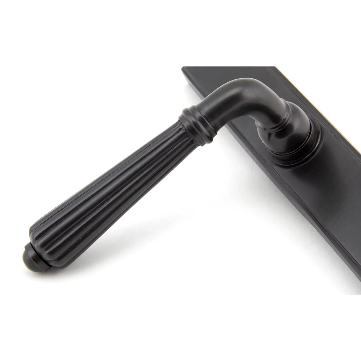 The Fluted Slimline Exterior Door Handle in an Aged Bronze Finish Showing a Close up of the Handle