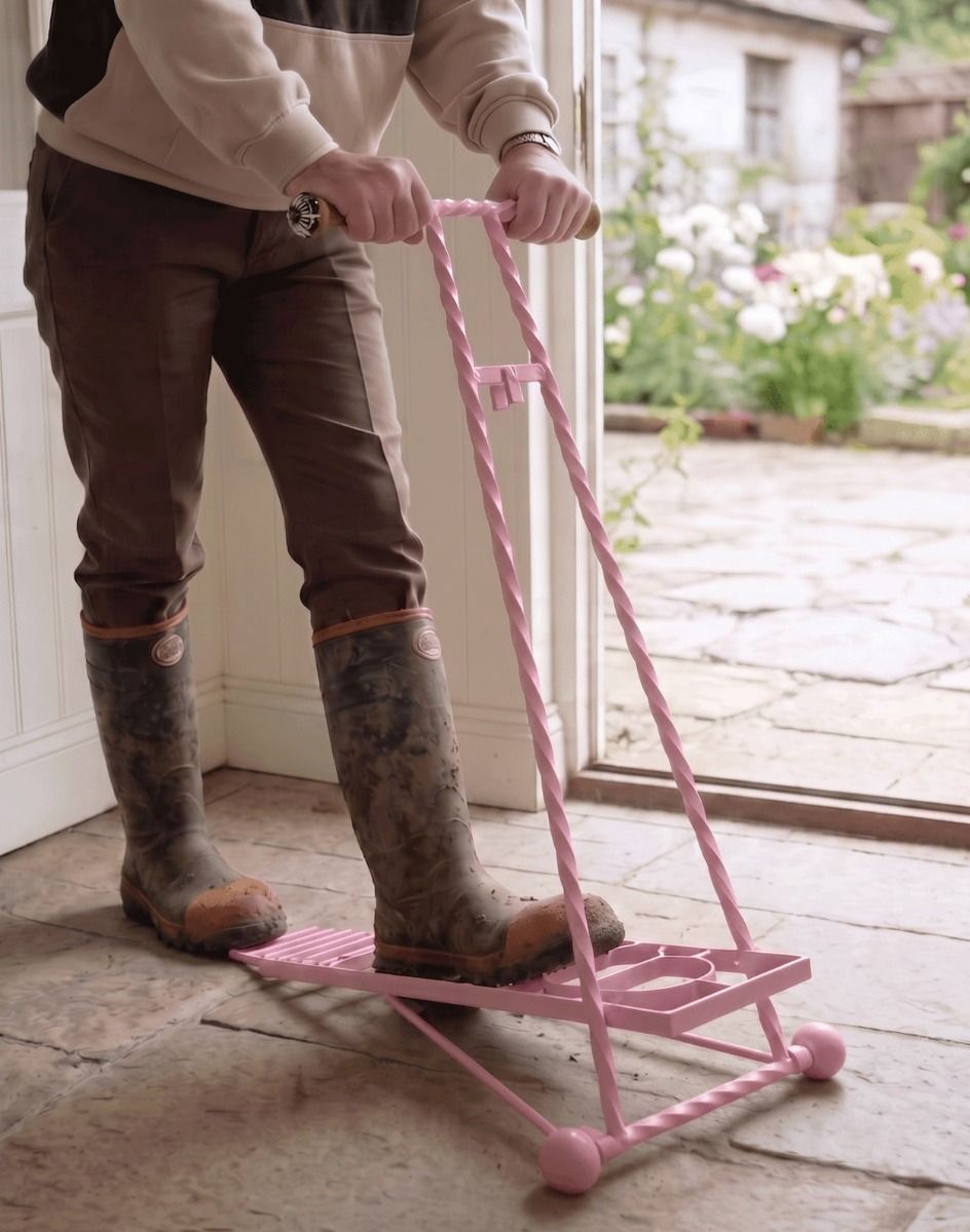 The Glenmore Pink Boot Jack Being Used in a Stone Tiled Garden Porch - Digital Illustration