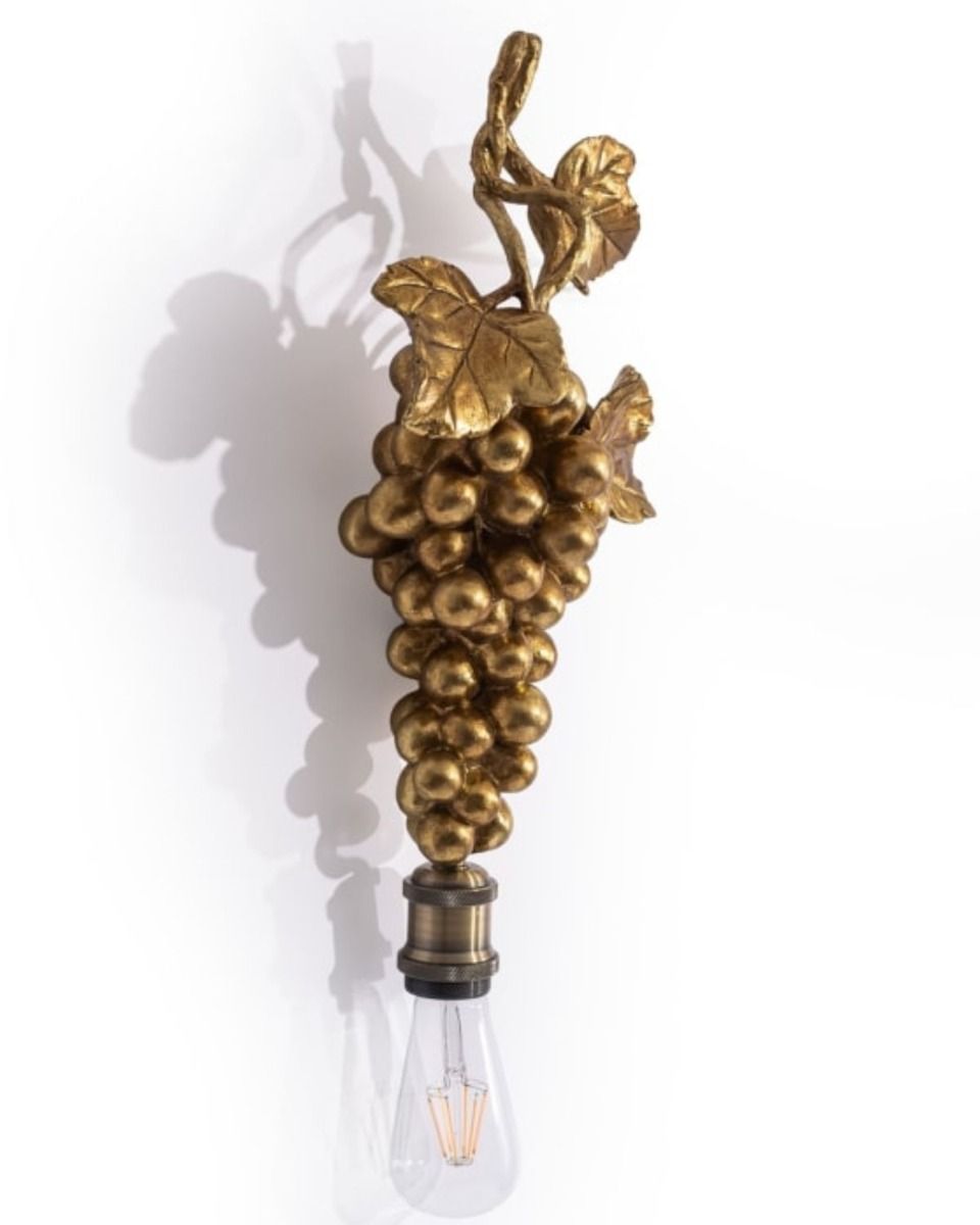 The Gold Finish Fruits of the Vine Wall Light Shown from the Side on a White Background 