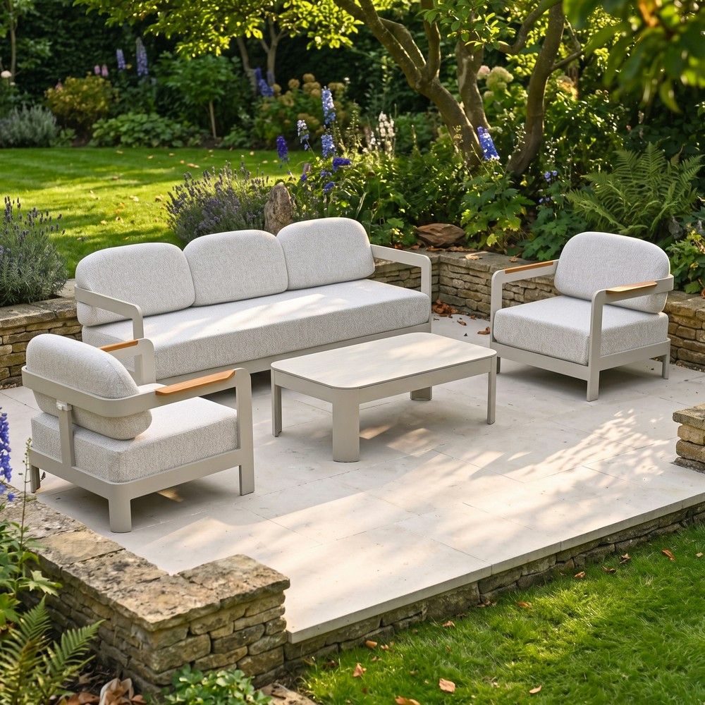 The Horizon 4 Piece Patio Suite Shown on a Detached Patio at the Centre of a Garden Lawn