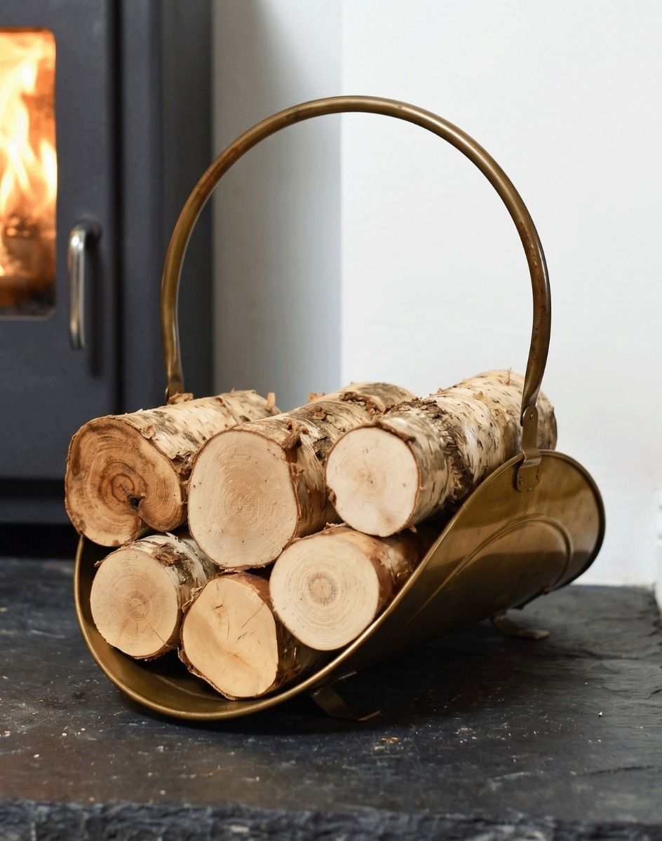 The “Houghton Avenue” Antique Style Log Holder next to a Lit Log Burner on a Black Stone Hearth - Digital Illustration