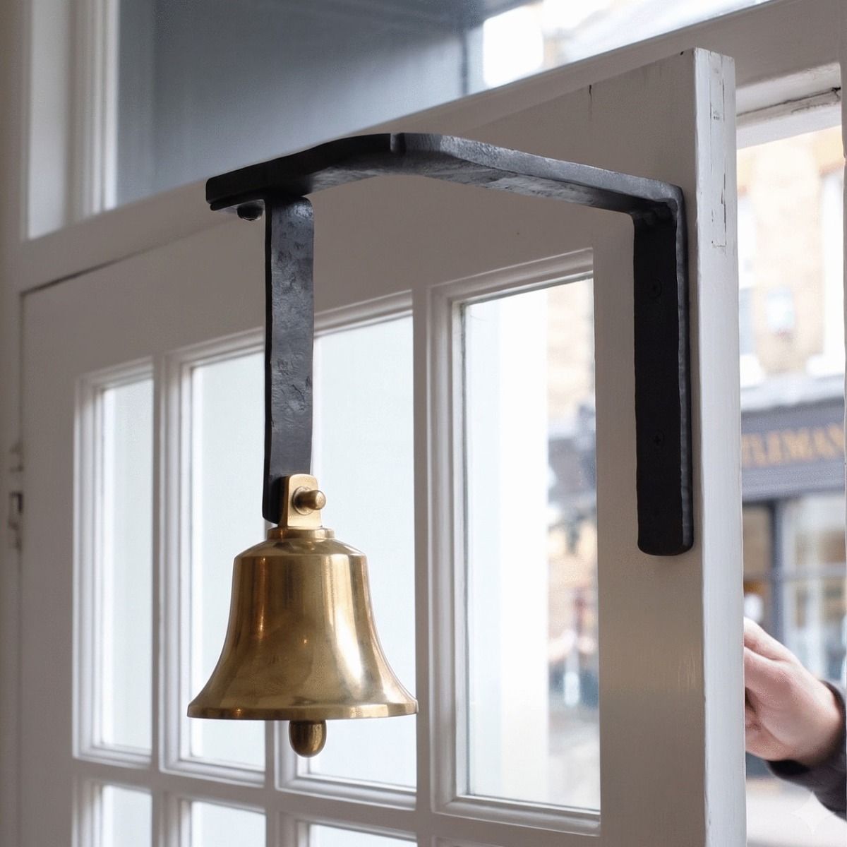 The Iron Bracketed Shop Keeper Door Bell on a White Door with Glass Panels - Digital Illustration