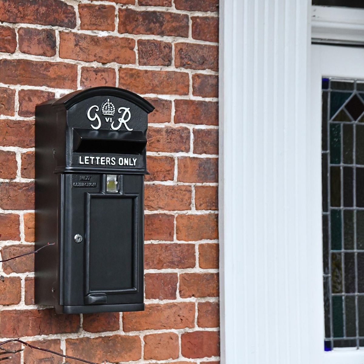 Black & White Slim King George Post Box In Situ by the Front Door