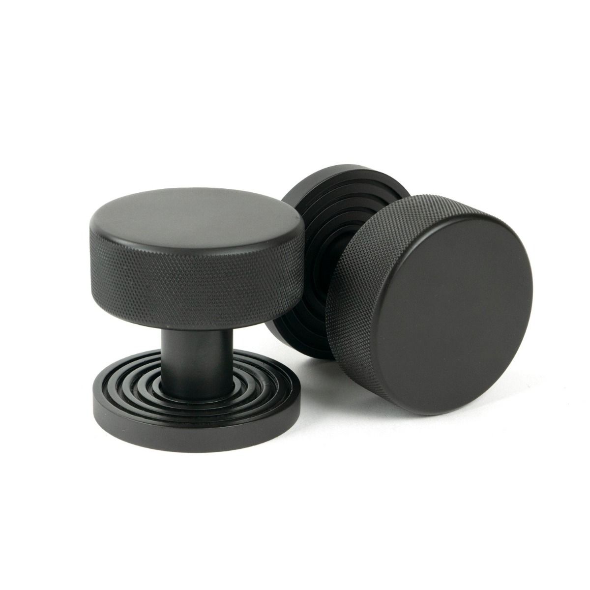 The Knurled Mortice/Rim Knob Set on a Beehive Rose in Aged Bronze Shown Upright and on its Side 