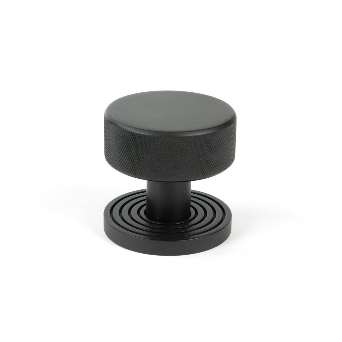 The Knurled Mortice/Rim Knob Set on a Beehive Rose in Aged Bronze Shown Upright on a White Background 