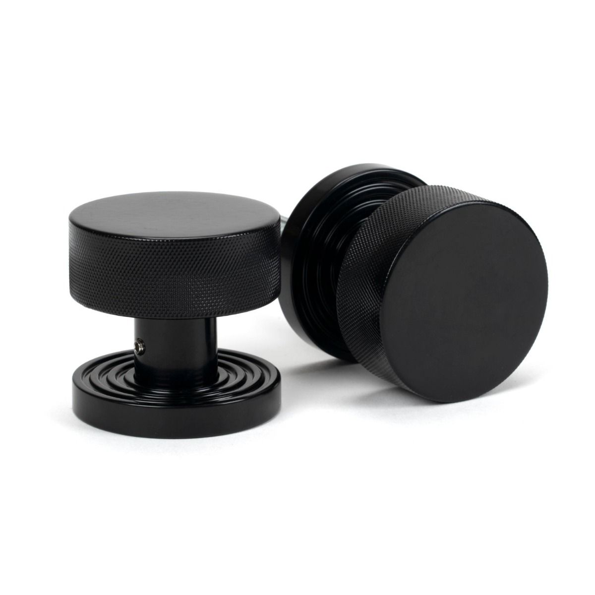 The Knurled Mortice/Rim Knob Set on a Beehive Rose in Black Shown Upright and on its Side 