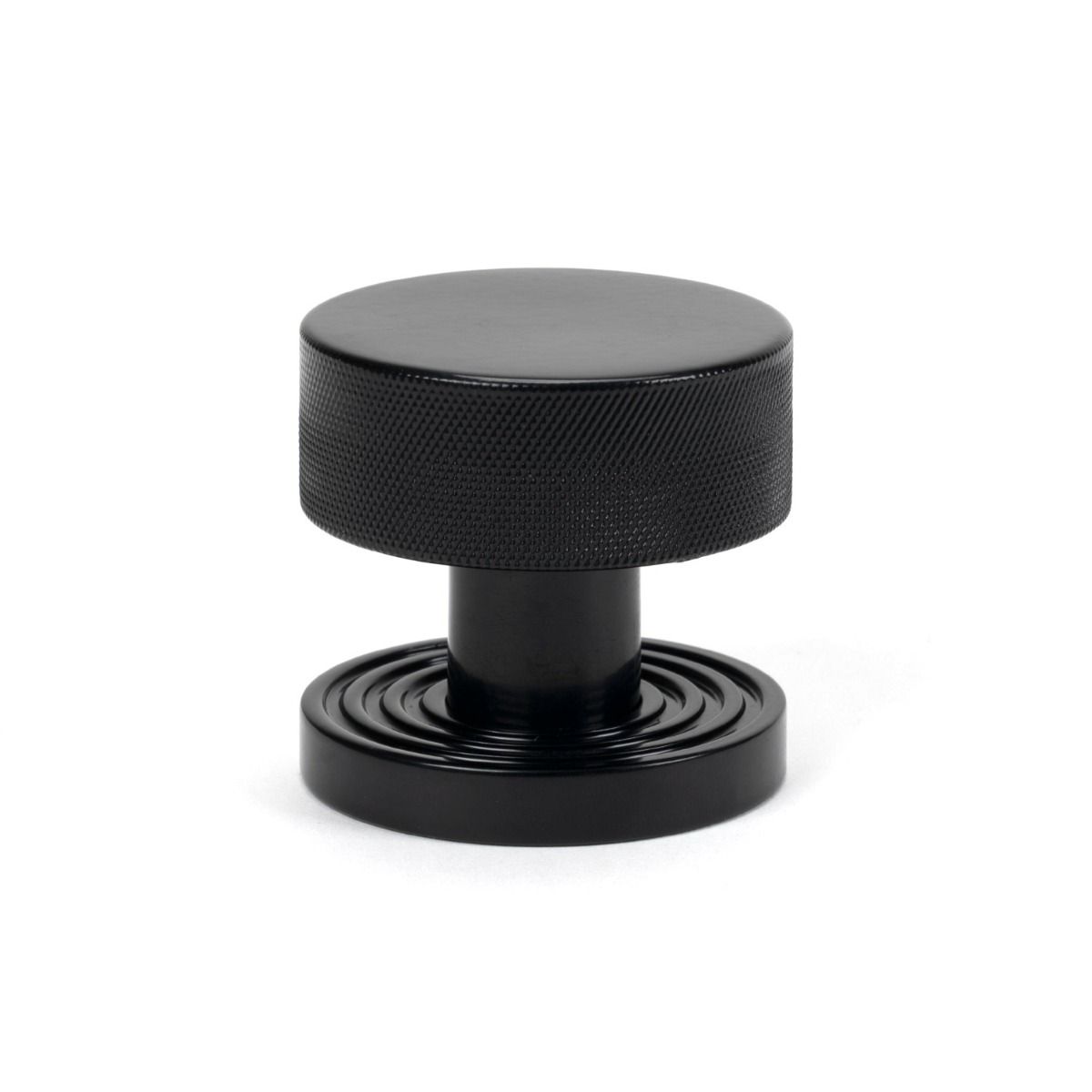 The Knurled Mortice/Rim Knob Set on a Beehive Rose in Black Shown Upright on a White Background 