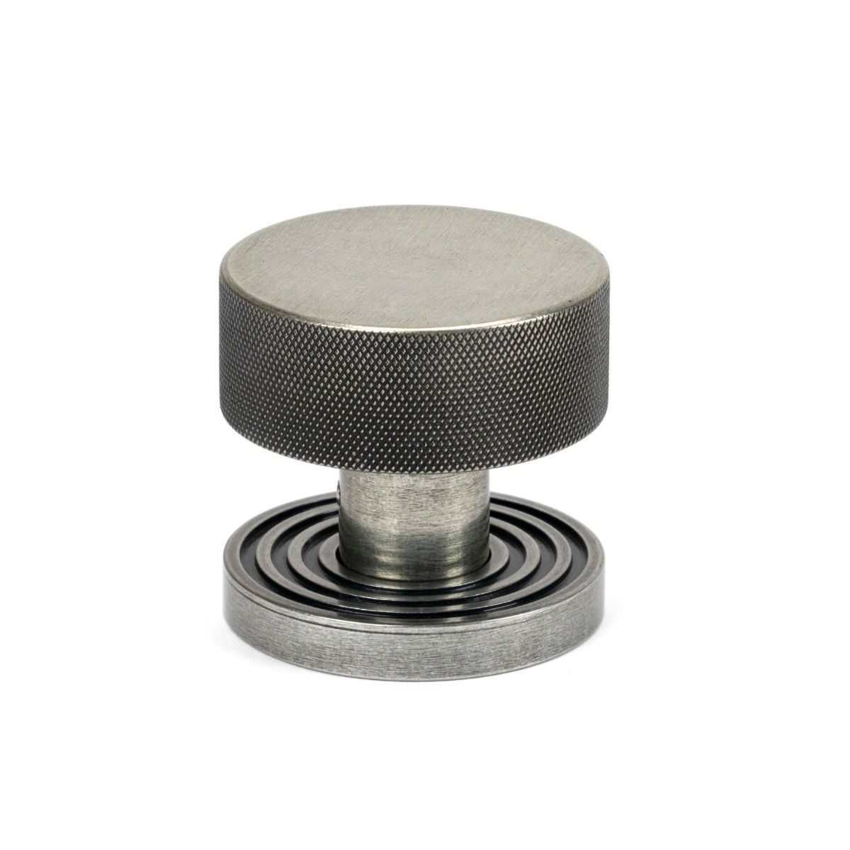 The Knurled Mortice/Rim Knob Set on a Beehive Rose in Pewter Shown Upright on a White Background 