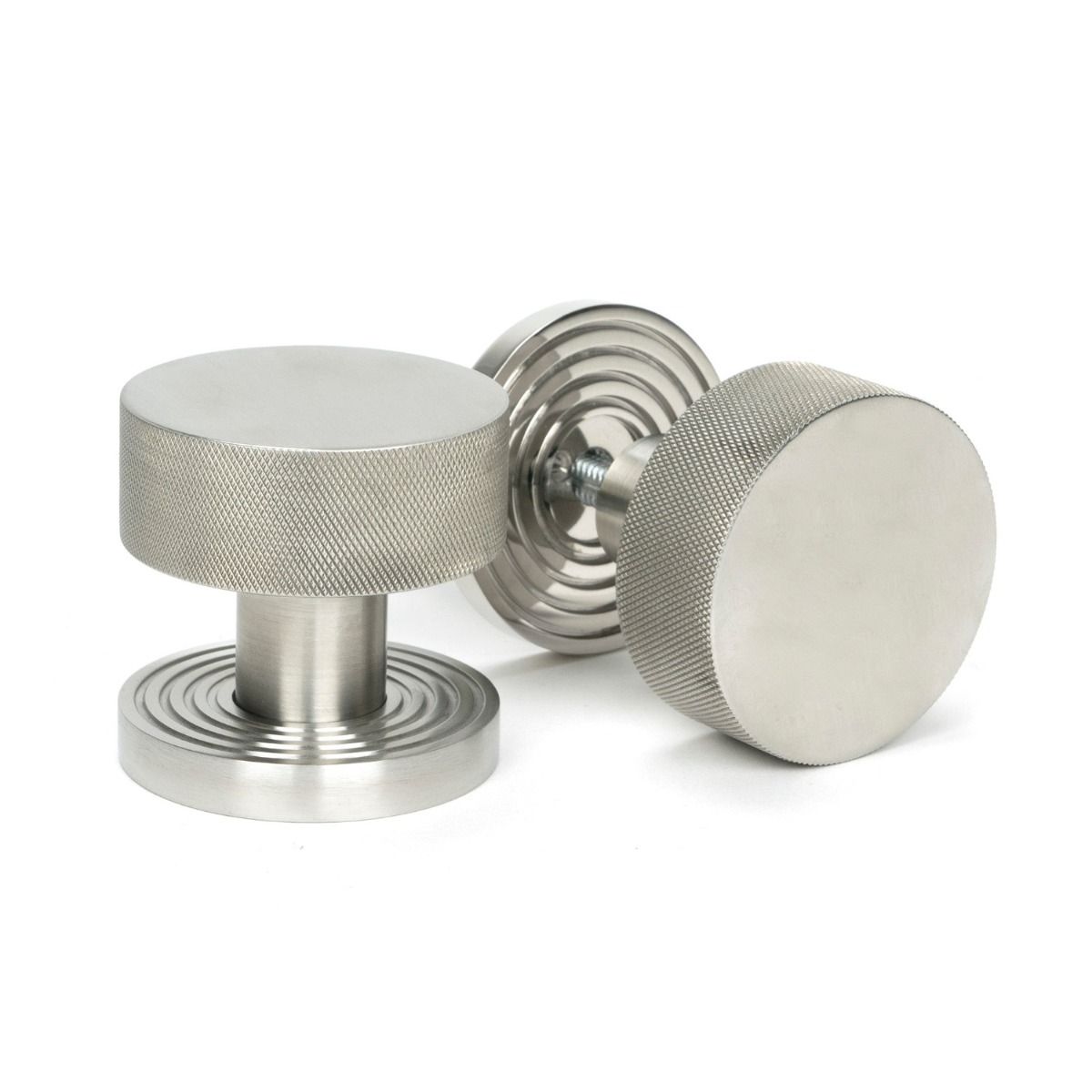 The Knurled Mortice/Rim Knob Set on a Beehive Rose in Satin Stainless Steel Shown Upright and on its Side 